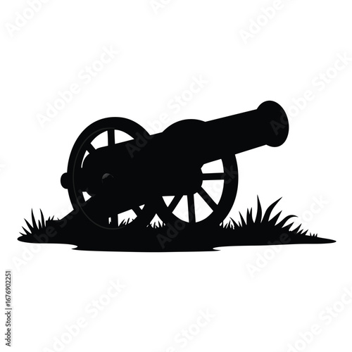 Black silhouette of an old cannon on grass artillery