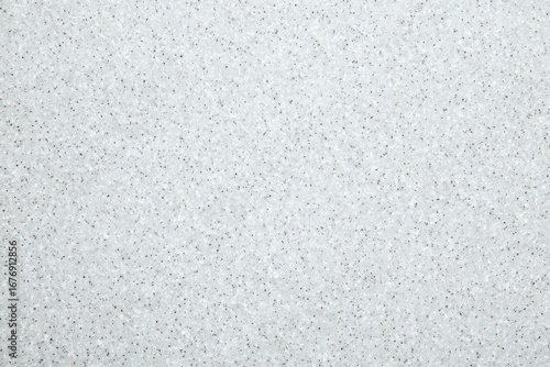 Close-up of a textured, light gray, granular material