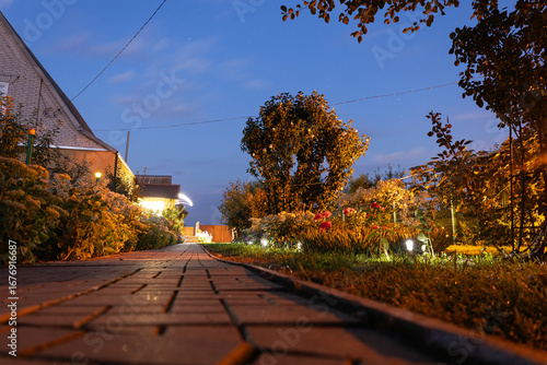 Inviting illuminated garden pathway and modern home exterior at twilight