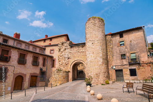 The Puerta de Hierro, an ancient gate leading to the Old Town of Sigüenza, a beautiful Spanish village, offers a stunning exterior view.