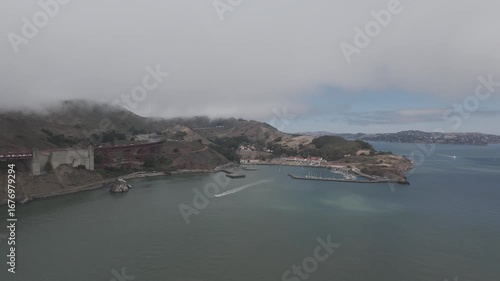 RAW Aerial of Fort Baker and Horseshoe Cove Marina beneath Marine Layer, Golden Gate National Recreation Area, San Francisco Bay — Advection Fog, Headlands, Harbor and Coastal Microclimate