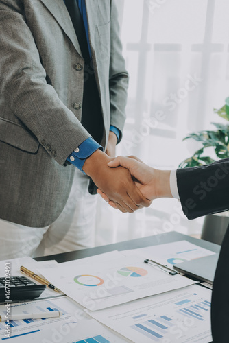 Business handshake for teamwork of business merger and acquisition,successful negotiate,hand shake,two businessman shake hand with partner to celebration partnership and business deal concept
