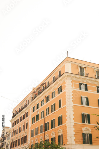 Classic Orange European Building with Green Shutters