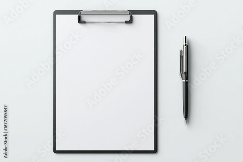 Office stationery concept with a clipboard, empty paper, and pen ready for writing.