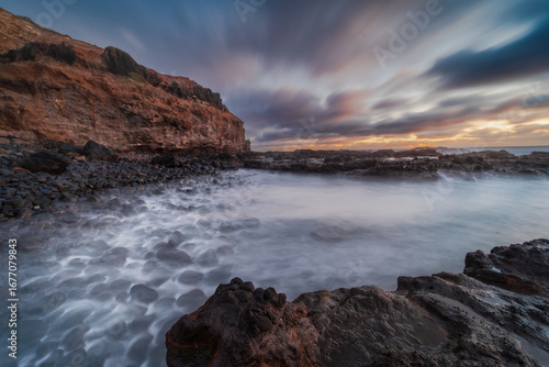 Coastal Inlet at Sunset with Long Exposure Water