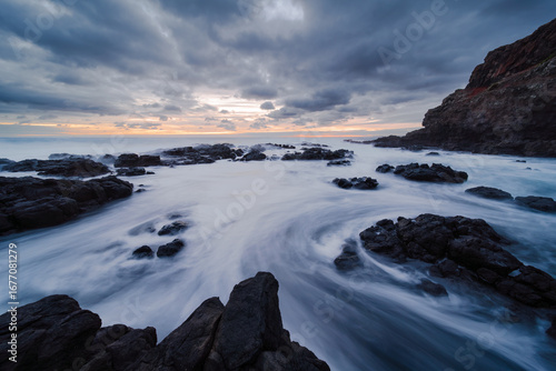 Coastal Inlet at Sunset with Long Exposure Water