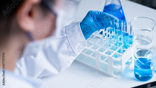 Professional Asian woman scientist chemist technician experiment research in chemistry laboratory data analysis result report scientific innovation document