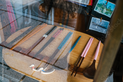 A Variety of Traditional Korean Chopsticks and Spoons on a Wooden Table