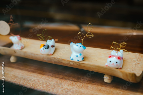 Cute Ceramic Animal Figurines on a Wooden Shelf