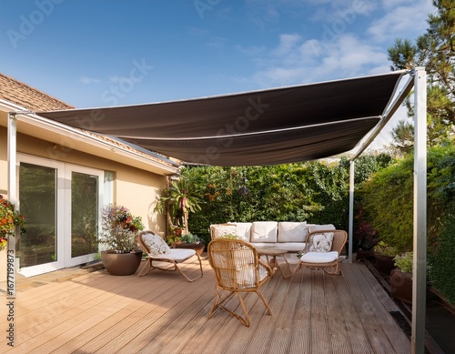 motorized retractable awning extending over a stylish patio with furniture outdoor luxury sun protection