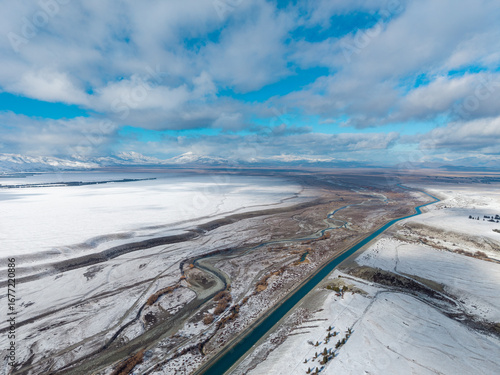 фотографія Aerial view lake Tekapo New Zealand landscape winter snowy 
purely in white