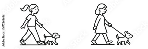 Two people walking dogs on leashes