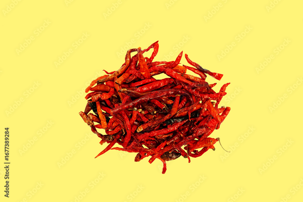 Fototapeta premium Dried chili pepper, chillies spicy. Isolated on yellow background 