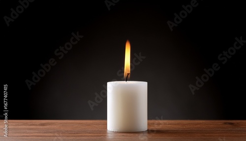 Wallpaper Mural white candle burning softly on surface against dark background Torontodigital.ca