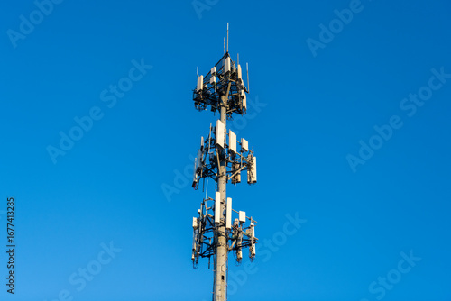 Cell phone tower. Wireless communication. Mobile service. Modern telecommunications infrastructure. Antenna technology of cellular base station. Cell site tower. Broadcasting tower station