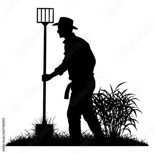 Farmer with Pitchfork works in field