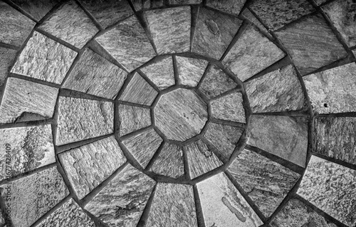 Background of Stone Tiles arranged Geometrically in Black and White.