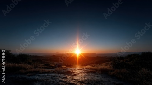 A breathtaking sunrise paints the landscape with vibrant hues of orange and gold, illuminating a serene mountain vista.