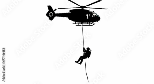Silhouette of rescuer rappelling from helicopter during a daring rescue operation