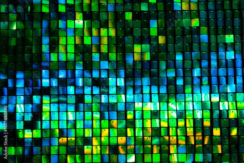 Wind Driven Shimmer Wall, Square metal reflectors shining