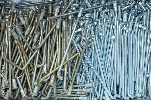 vertical texture steel short threaded chromed with heads and fasteners industrial old shiny spokes for wheel rim