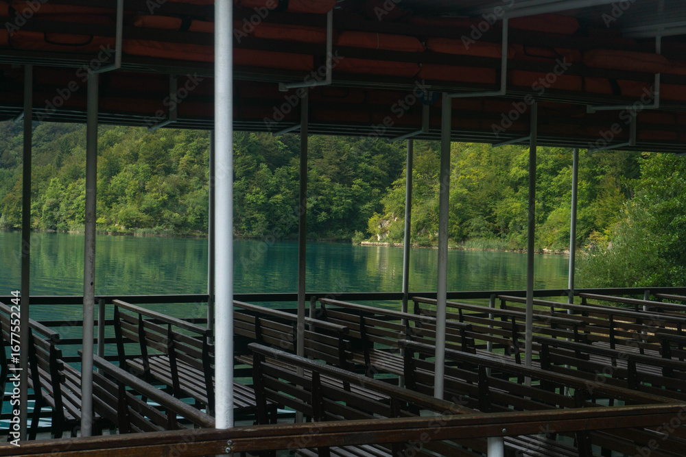 Fototapeta premium Empty seats in the ferry boat at the Plitvice Lakes National Park (Plitvička Jezera, Croatia)