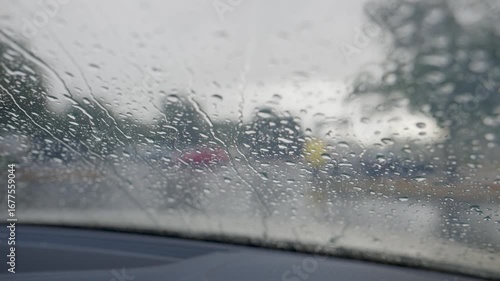 Rain falling on car windscreen 