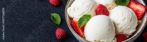 Bowl of creamy vegan desserts made with dairy free coconut milk, garnished with fresh raspberries, strawberries, and mint leaves, creating refreshing and indulgent treat
