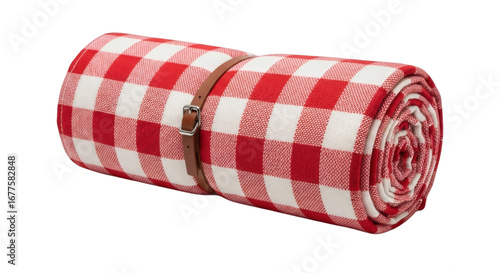 Rolled red checkered picnic blanket tied elegantly awaiting outdoor adventures and summer leisure activities