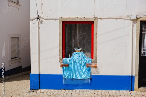 Traditional Portuguese Window with Religious Decoration