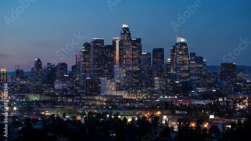 Wallpaper Mural A panoramic view of the Los Angeles skyline at sunset, showcasing modern skyscrapers against the vibrant twilight hues. Torontodigital.ca