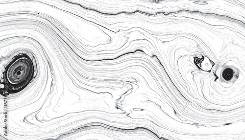 Intricate black and white swirling patterns create an abstract design, suggestive of natural wood grain.