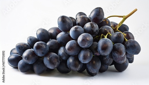 a cluster of dark grapes against a white background white background