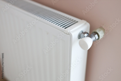 Wallpaper Mural White home radiator with control valve on pink wall for efficient heating Torontodigital.ca