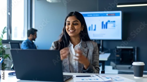 A Business Professional Engaged in a Video Conference in a Modern Office Setting
