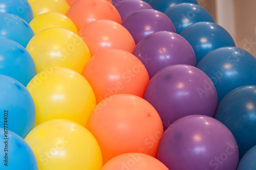 Colorful balloons decoration in vibrant rainbow tones, festive party background