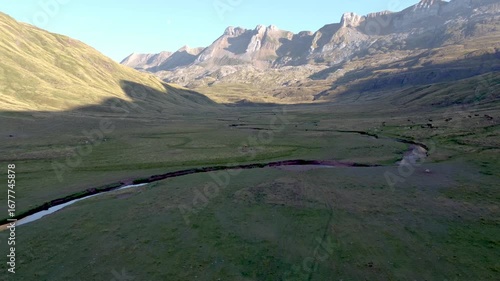 aerial drone view of sinuous river in the pyrenees mountains 