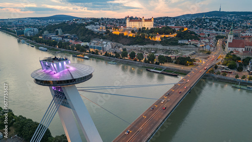 Photography Sunset view of SNP bridge and panorama of Bratislava, Slovakia