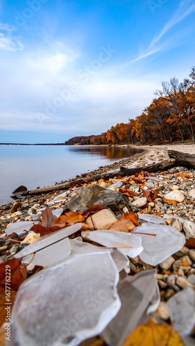 Autumn lake shore with ice