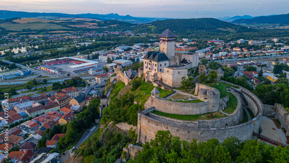 Obraz premium Sunset with Trencin castle overlooking the old town, Slovakia
