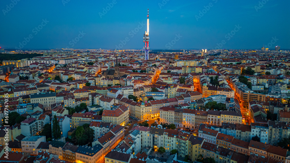 Fototapeta premium Sunset view of Zizkov TV tower overlooking Prague, Czech republi