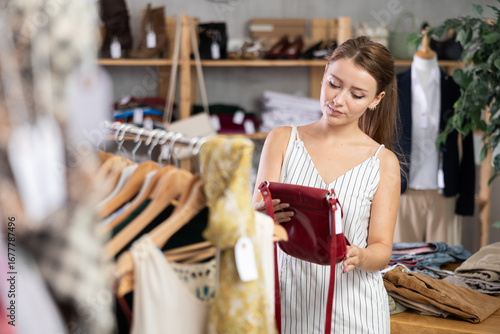 Fotografija Woman shopping in clothing department, buying lady handbag