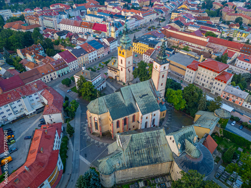 Sunset view of city castle and Church of the Assumption of virgi