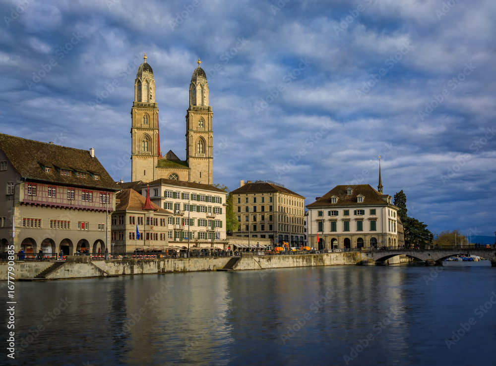 Fototapeta premium Zurich Cityscape with Limmat River and iconic Grossmunster cathedral Switzerland