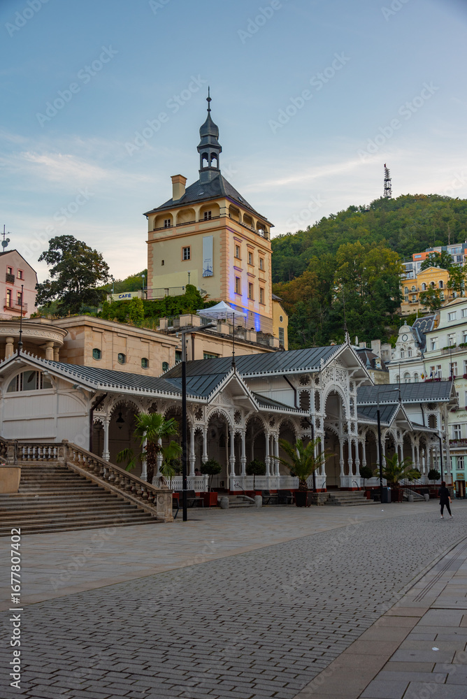Fototapeta premium Sunset view of castle tower and market colonnade in Karlovy Vary