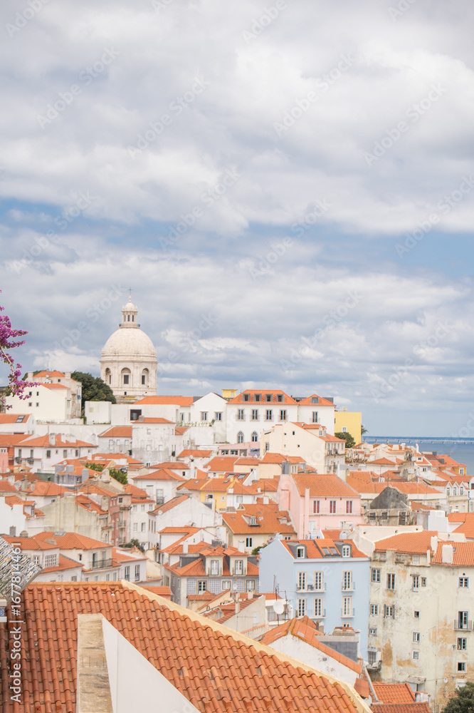 Fototapeta premium Stunning travel and lifestyle photography of Lisbon, Portugal, showcasing its famous red rooftops, main tourist attractions, and romantic experiences for couples.