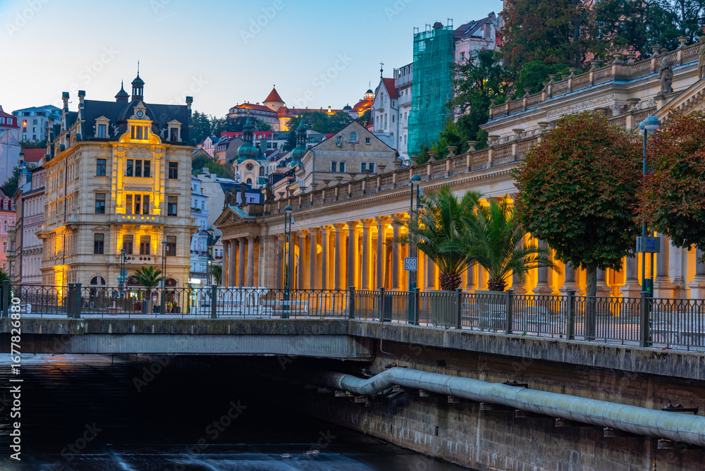 Fototapeta premium Night view of colourful houses reflecting on Tepla river in Karl