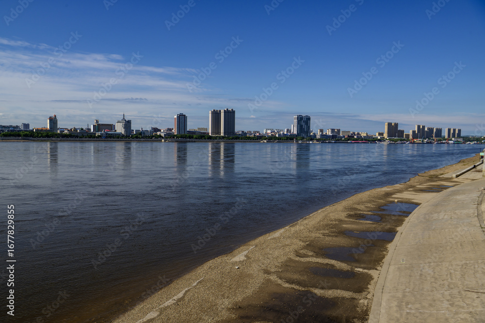 Obraz premium View of the city of Heihe from Blagoveshchensk and the Amur River, Russia August 18, 2025