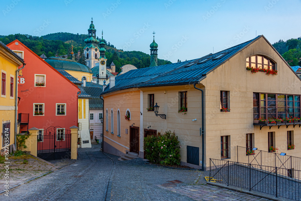 Fototapeta premium Sunrise view of a street in the old town of Banska Stiavnica, Sl