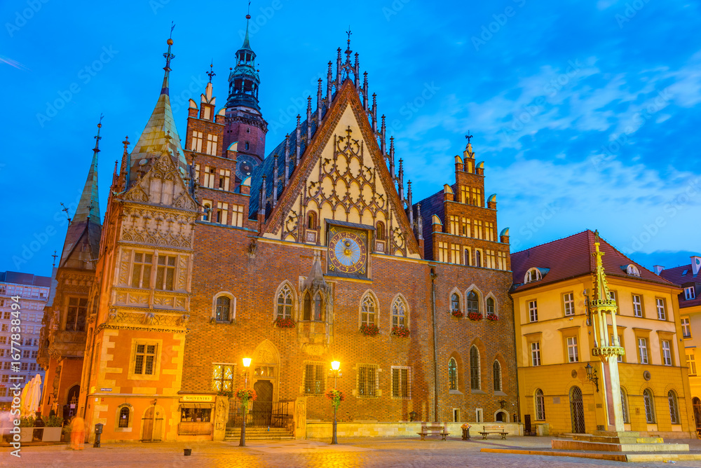 Fototapeta premium Sunrise view of town hall at Rynek, the picturesque square in ce